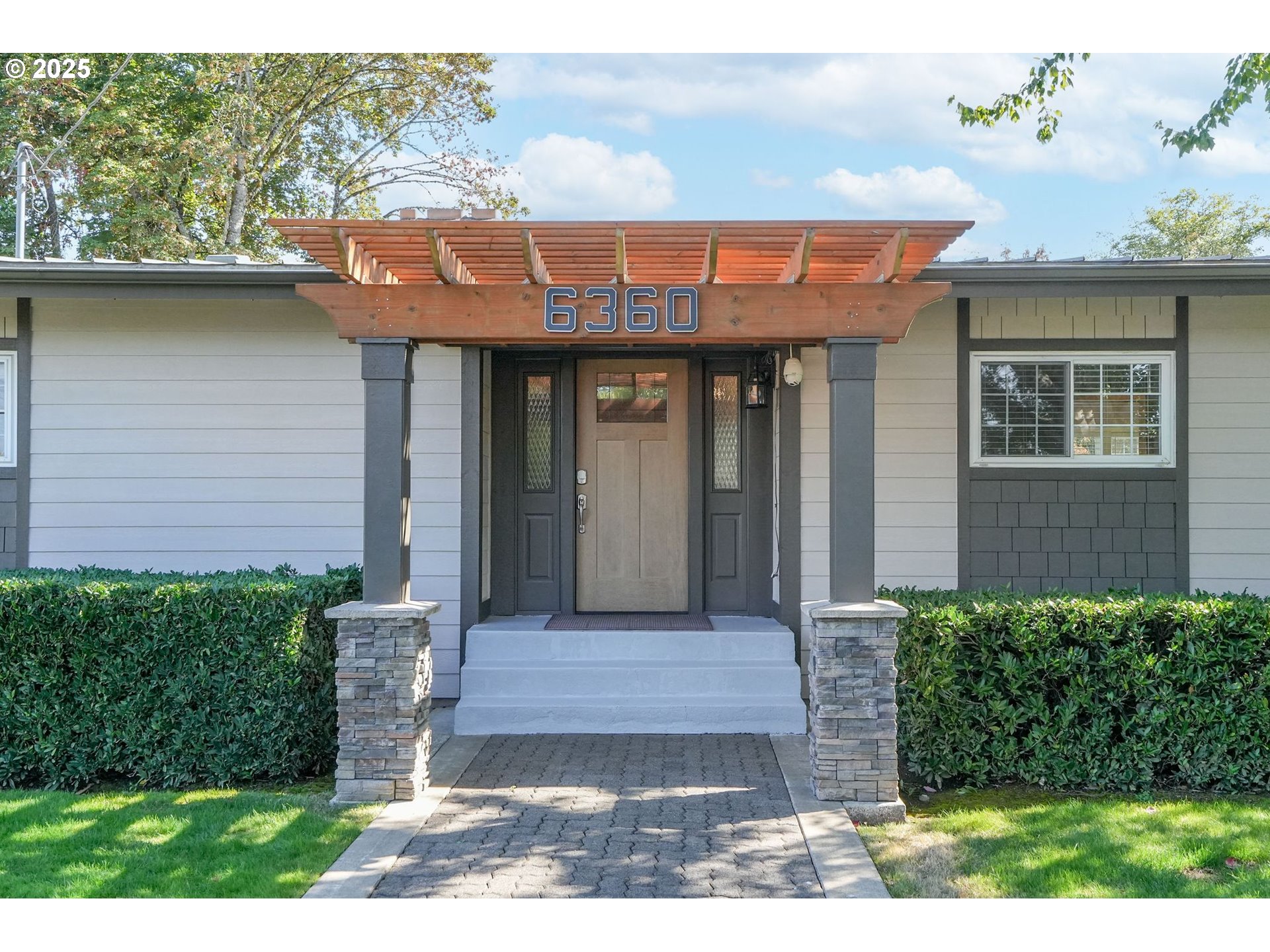 a front view of a house with garden