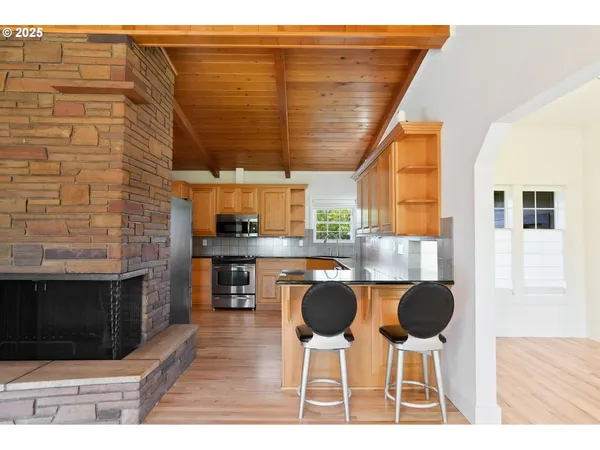 a kitchen with a cabinets and chairs