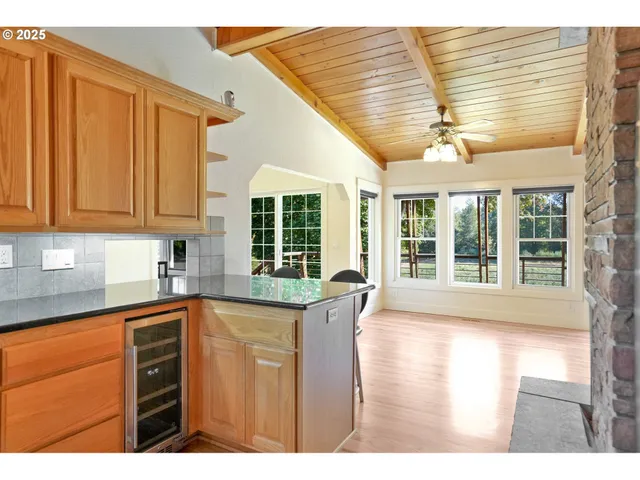 a view of a kitchen with a sink and cabinets