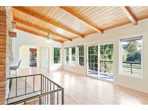 a view of an entryway with wooden floor