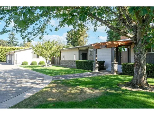 a house view with a sitting space and garden