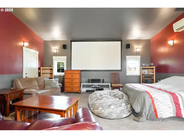 a living room with furniture a rug and kitchen view