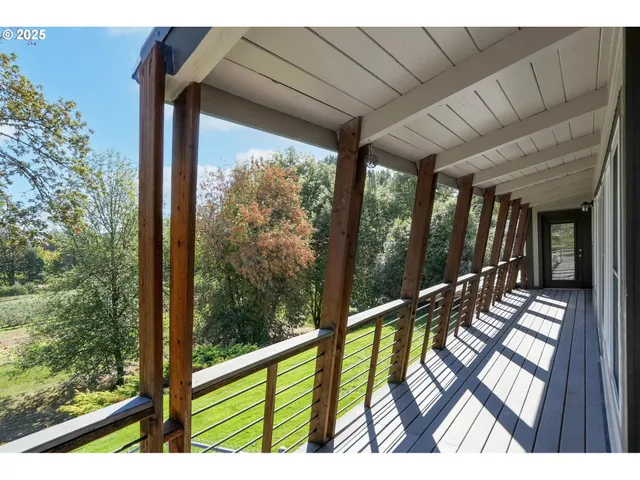a view of balcony with wooden floor