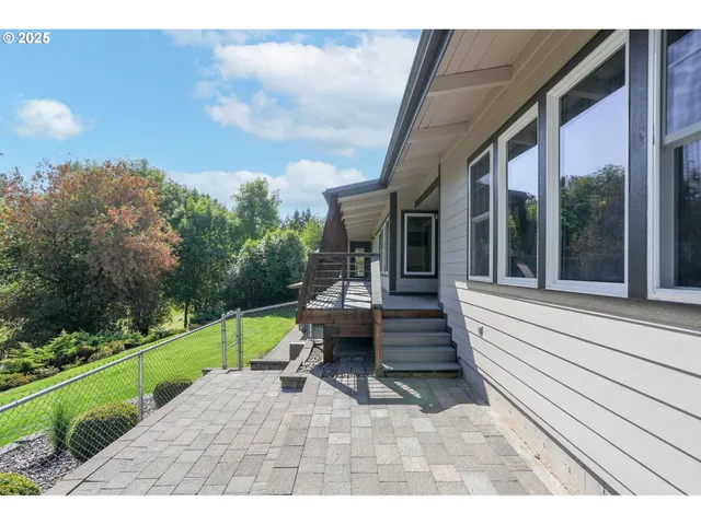 a view of a house with backyard and porch