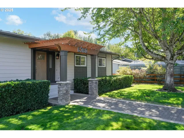 a view of a house with a yard