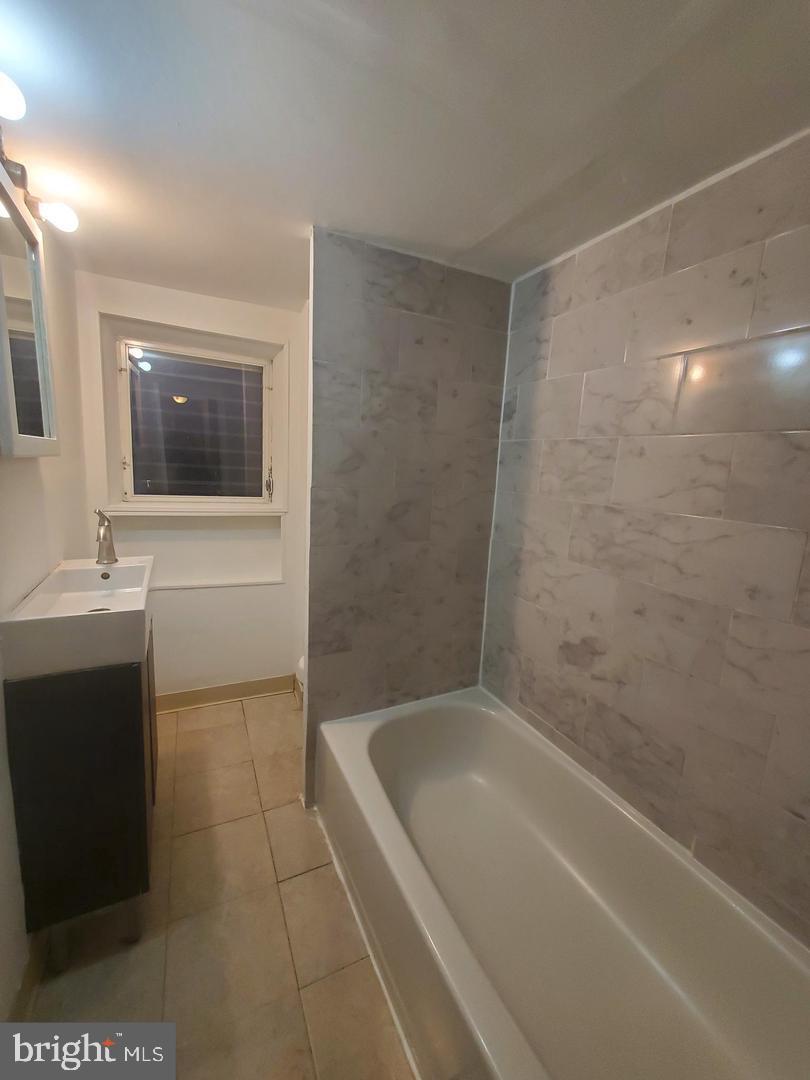 1 Old Ashton Road Philadelphia, PA 19152 - Photo 17 of 18 a bathroom with a bathtub a sink a toilet and mirror