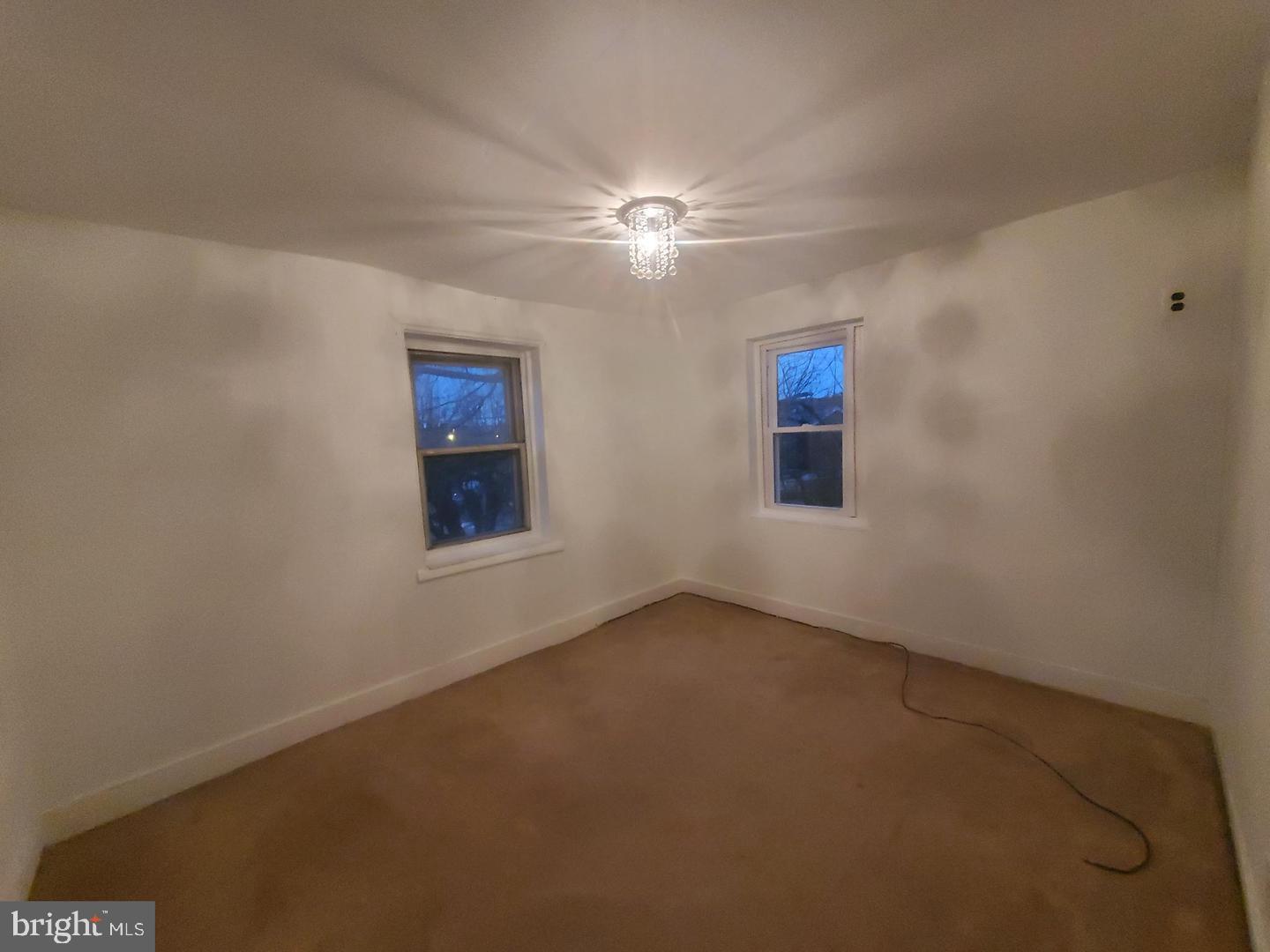 1 Old Ashton Road Philadelphia, PA 19152 - Photo 7 of 18 an empty room with windows and fan