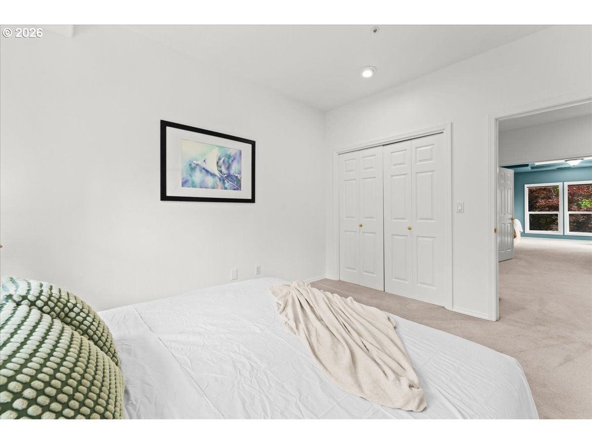 12431 Southwest 55th Place Portland, OR 97219 - Photo 22 of 40 a view of a bedroom with wooden floor