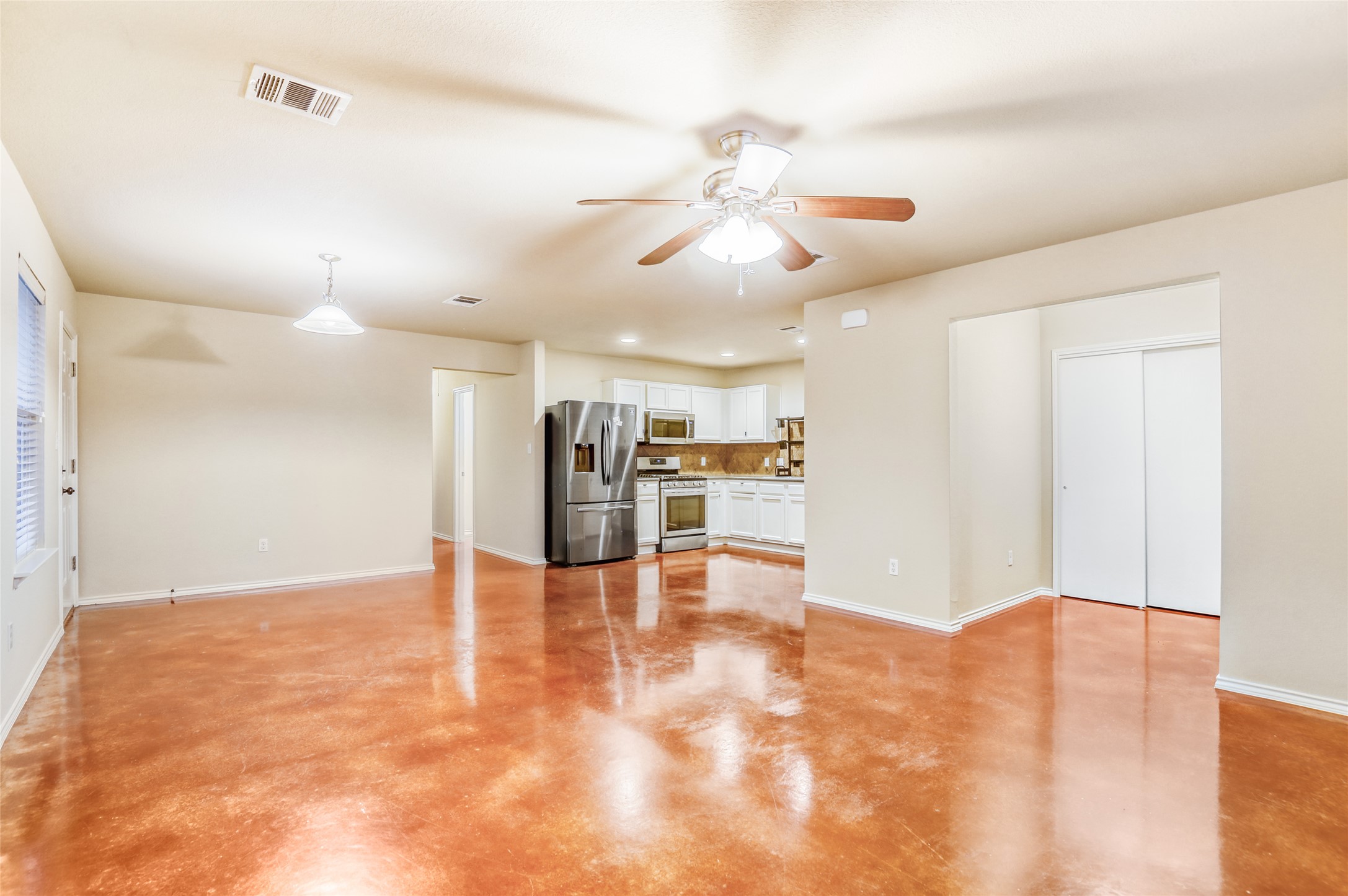 4620 Best Way Austin, TX 78725 - Photo 4 of 11 a view of an empty room and kitchen view