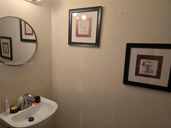a bathroom with a sink and mirror