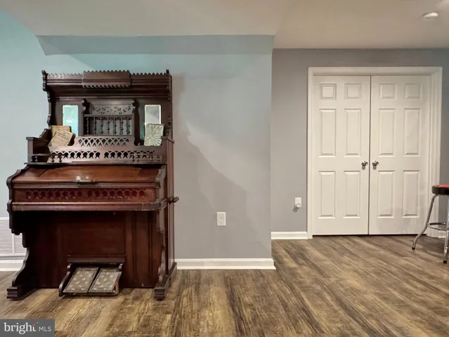 a view of a balcony with wooden floor and fence
