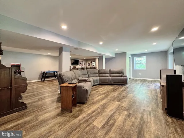 a living room with furniture fireplace and a table