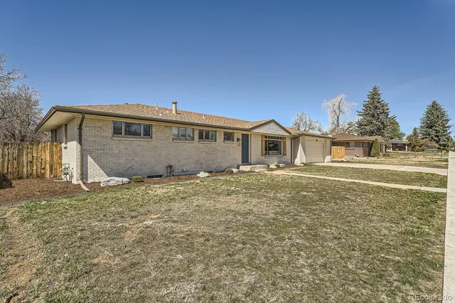 a house view with a backyard space
