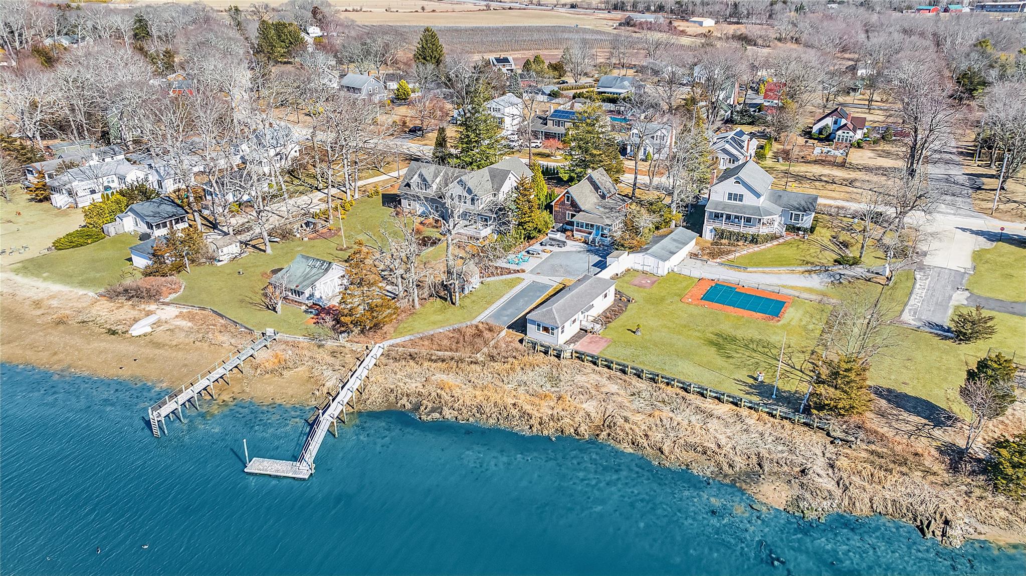 an aerial view of a residential houses with outdoor space