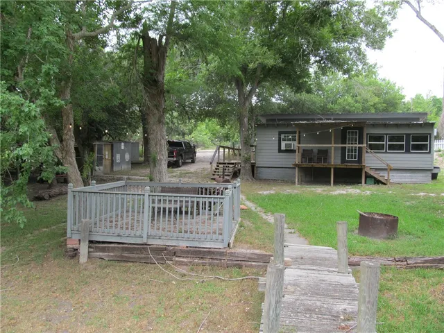 a view of a deck with a wooden fence and floor