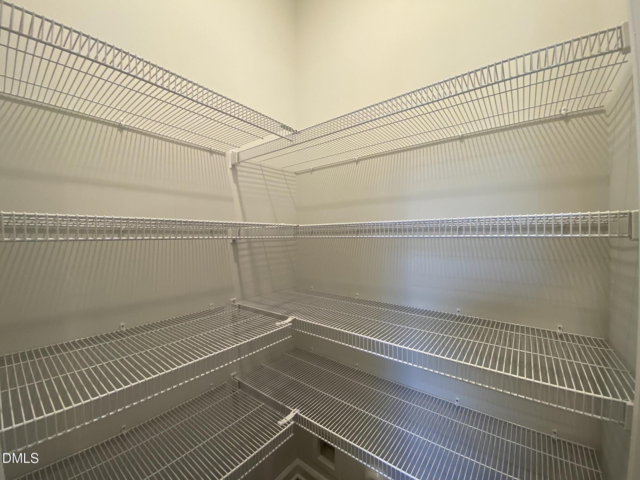 218 Loxton Street Fuquay-Varina, NC 27526 - Photo 14 of 37 a view of a room with racks on the wall