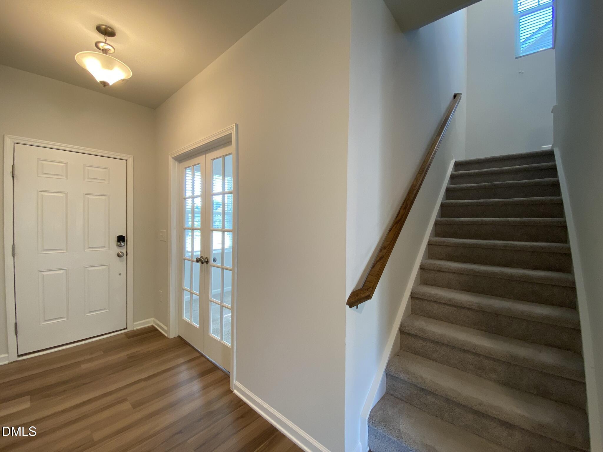 218 Loxton Street Fuquay-Varina, NC 27526 - Photo 16 of 37 wooden floor in an empty room with a window
