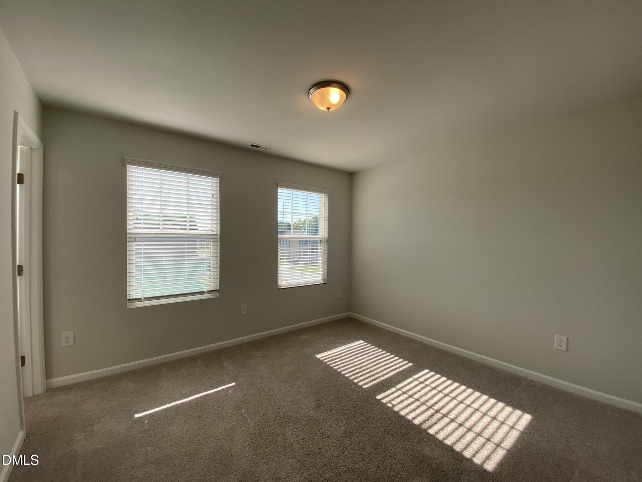 218 Loxton Street Fuquay-Varina, NC 27526 - Photo 19 of 37 a view of an empty room with a window