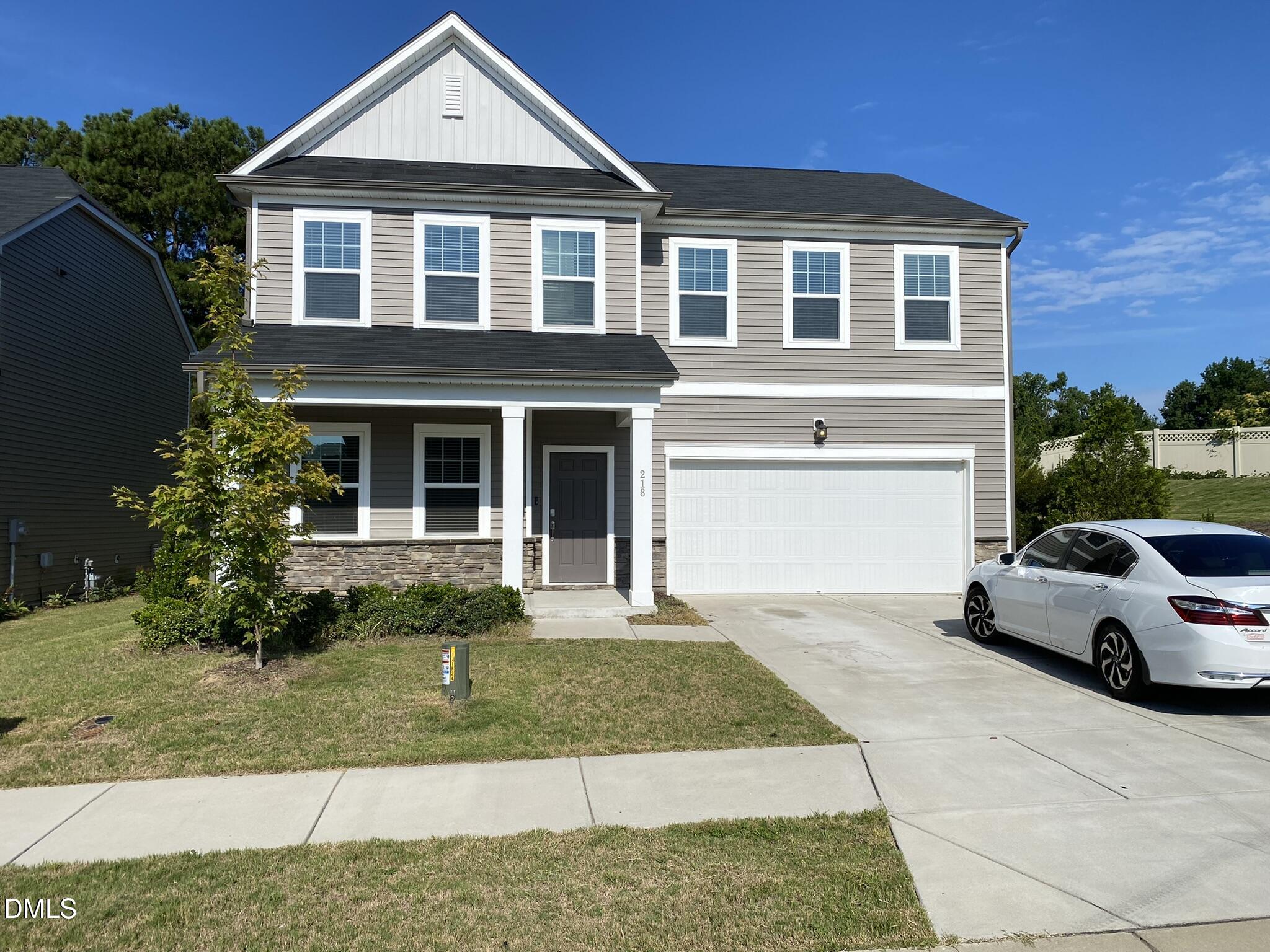 218 Loxton Street Fuquay-Varina, NC 27526 - Photo 2 of 37 a front view of a house with a yard
