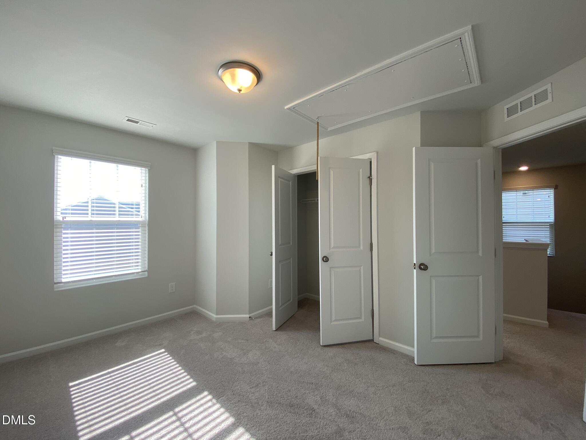 218 Loxton Street Fuquay-Varina, NC 27526 - Photo 22 of 37 a view of an empty room with a window