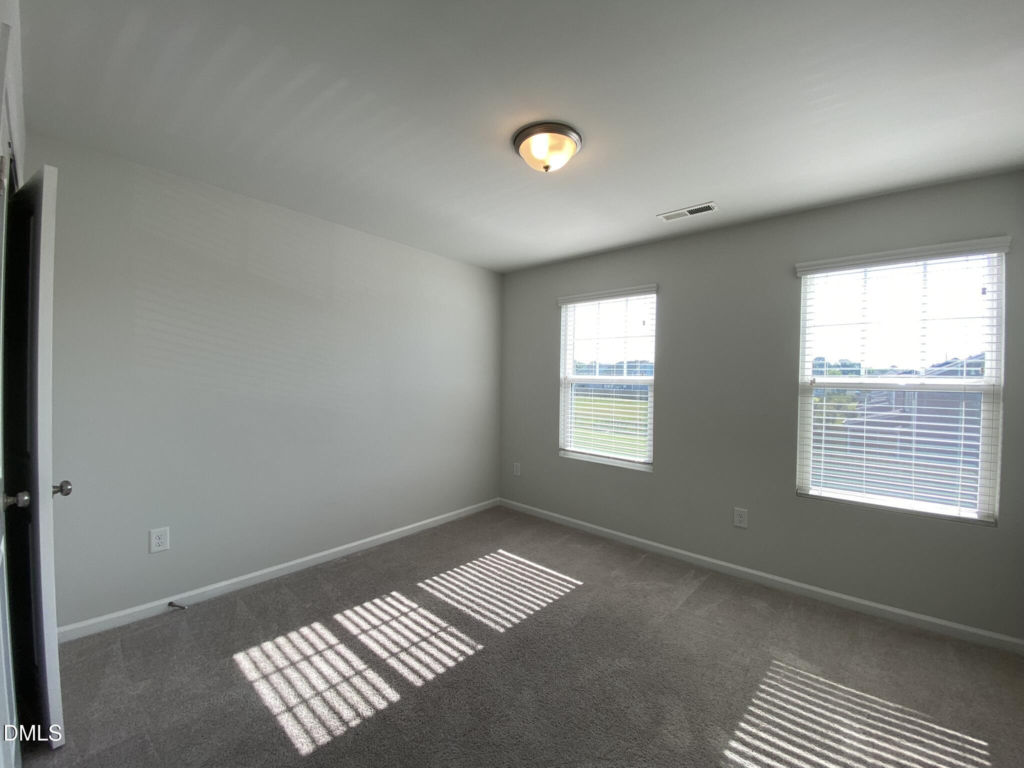 218 Loxton Street Fuquay-Varina, NC 27526 - Photo 25 of 37 a view of an empty room with a window