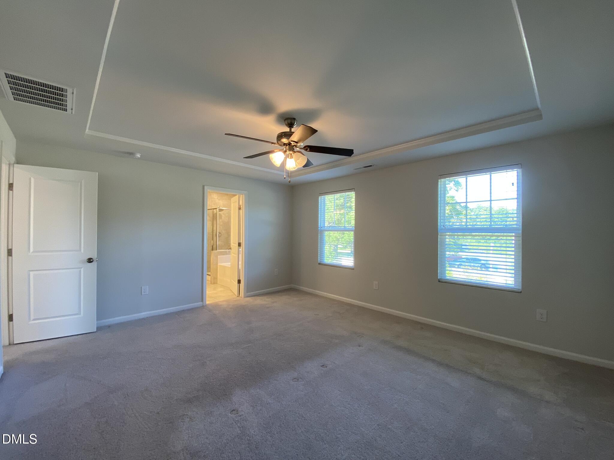 218 Loxton Street Fuquay-Varina, NC 27526 - Photo 26 of 37 a view of a livingroom with a ceiling fan and window