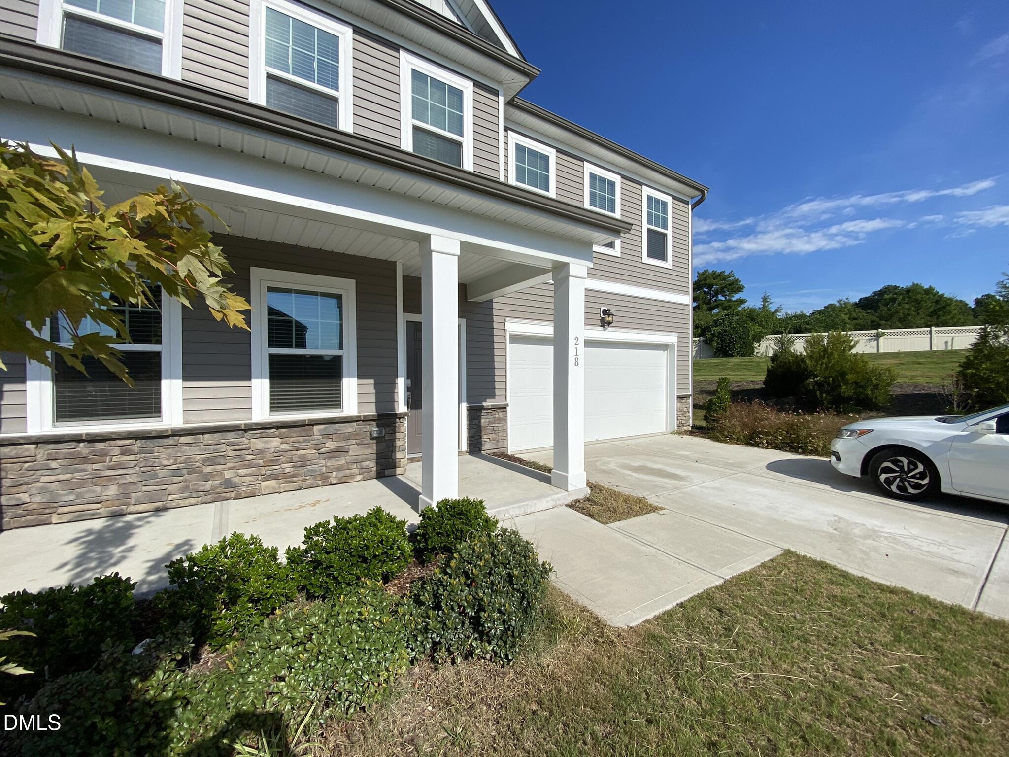 218 Loxton Street Fuquay-Varina, NC 27526 - Photo 3 of 37 a view of a house with a yard
