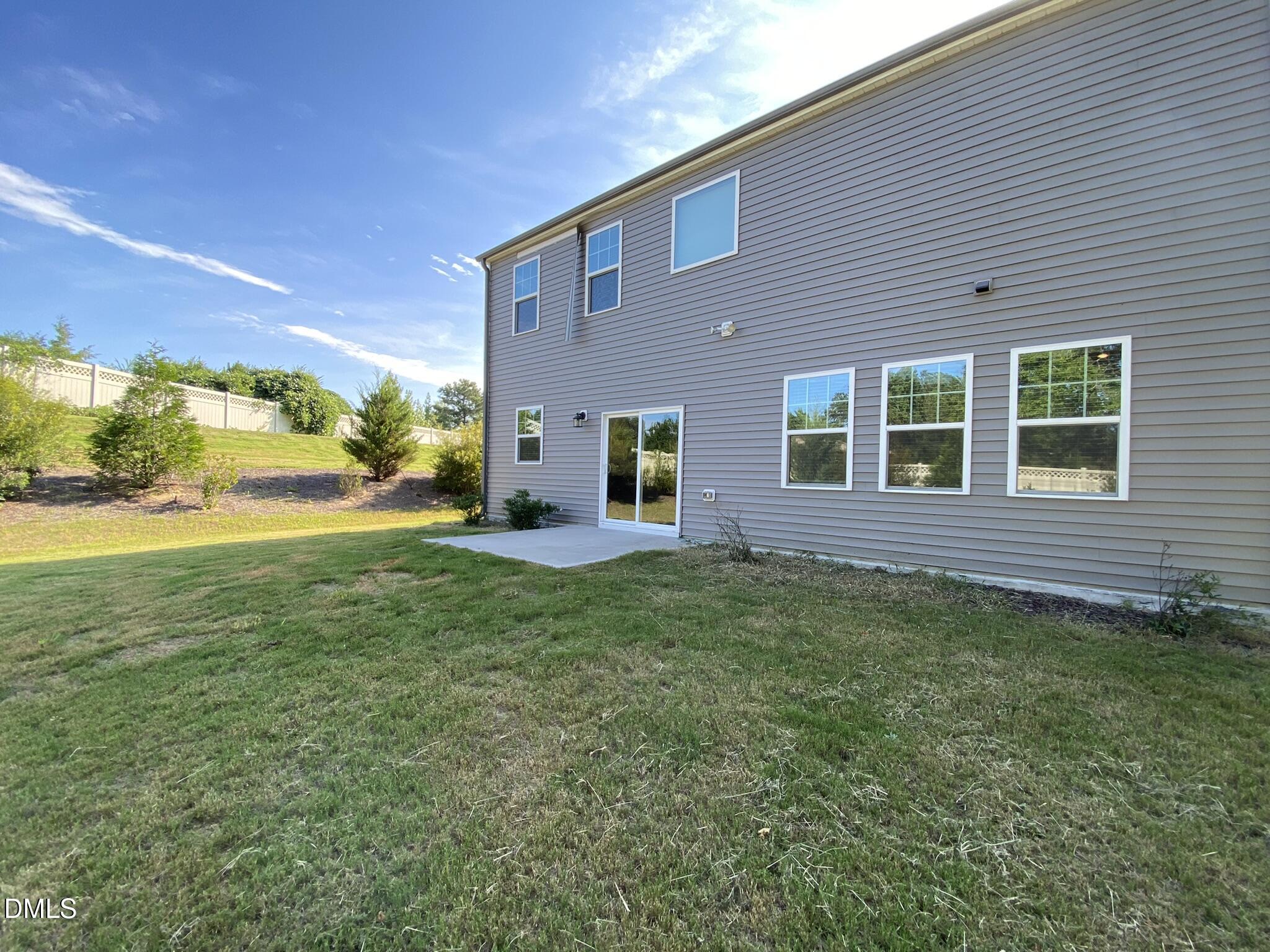 218 Loxton Street Fuquay-Varina, NC 27526 - Photo 36 of 37 a view of a house with backyard and garden