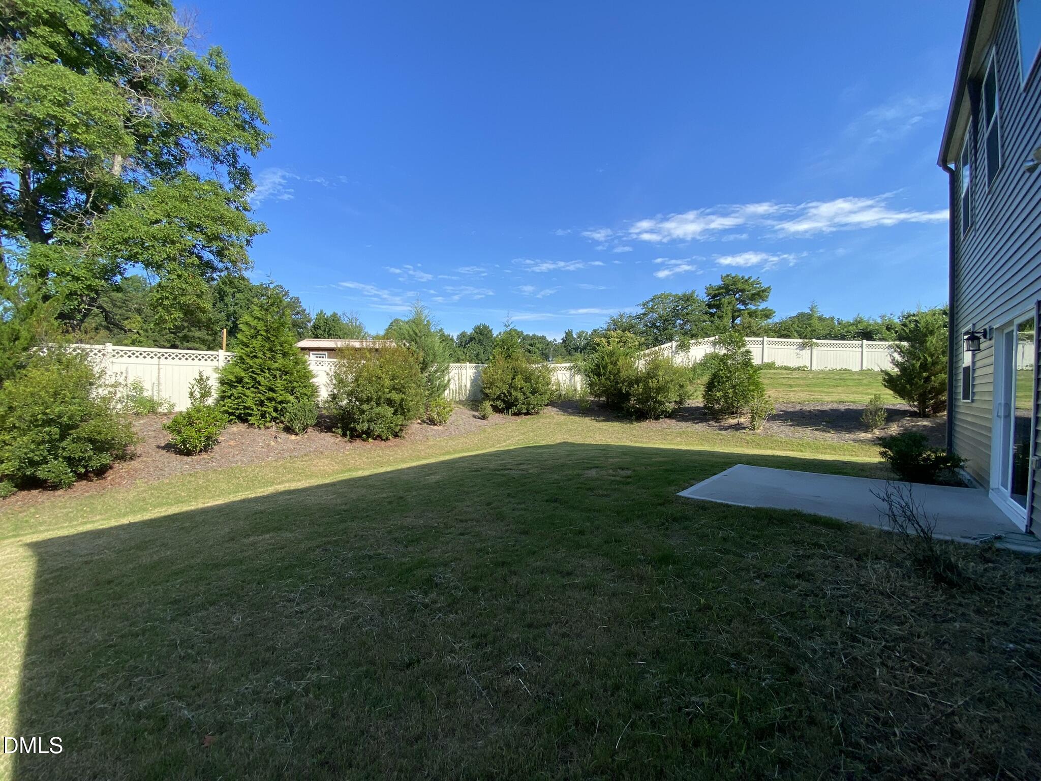 218 Loxton Street Fuquay-Varina, NC 27526 - Photo 37 of 37 a view of a garden and mountains