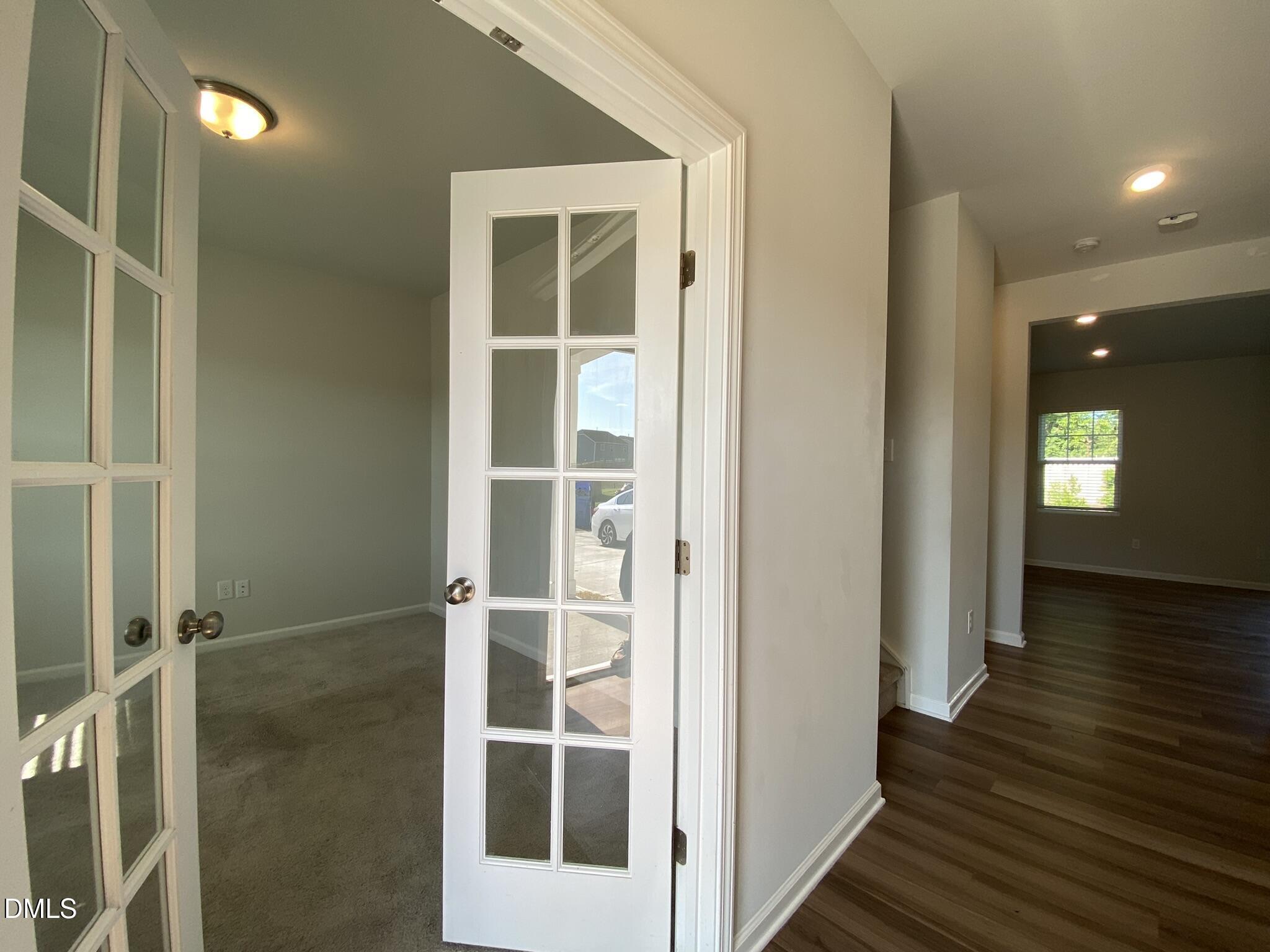 218 Loxton Street Fuquay-Varina, NC 27526 - Photo 4 of 37 a view of a hallway with wooden floor and entryway