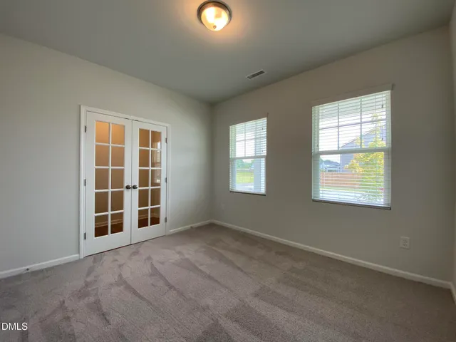 an empty room with windows