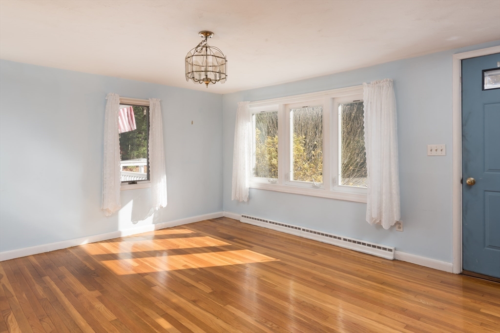 25 Lawrence Road Halifax, MA 02338 - Photo 7 of 22 a view of an empty room with window and wooden floor