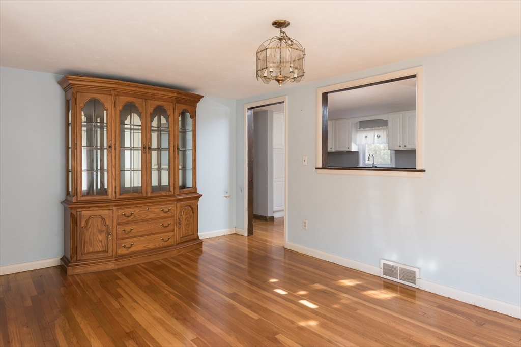 25 Lawrence Road Halifax, MA 02338 - Photo 9 of 19 wooden floor in a hall with a window