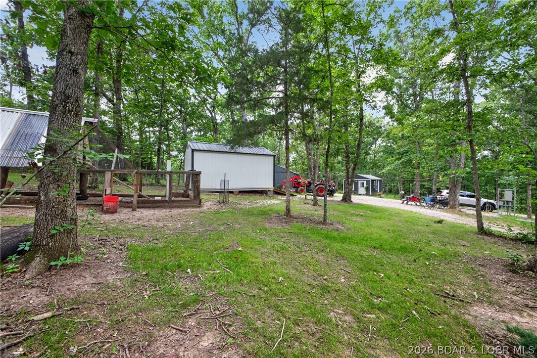 25145 State Route West Barnett, MO 65011 - Photo 31 of 58 Tool shed/workshop & pygmy coop