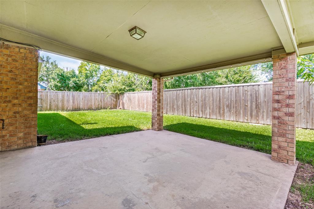 508 South Pedigo Street Pilot Point, TX 76258 - Photo 24 of 26 Covered patio featuring a concrete slab and brick columns