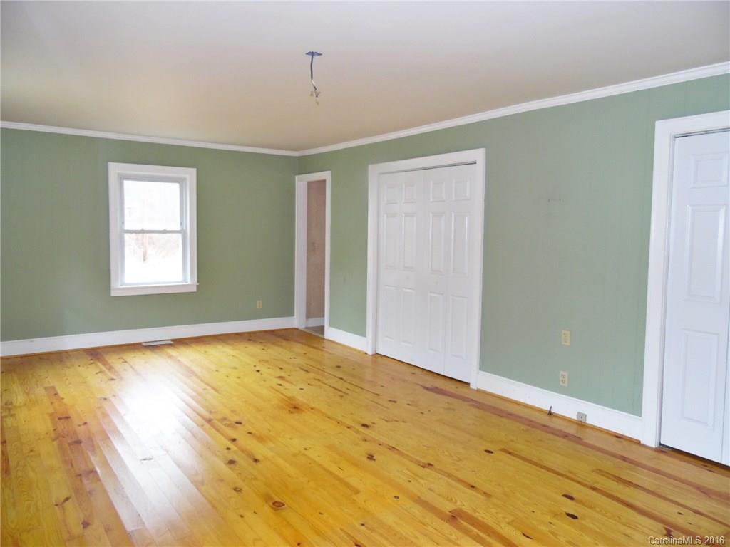 2106 Pinckney Road Chester, SC 29706 - Photo 12 of 18 a view of empty room with wooden floor and fan