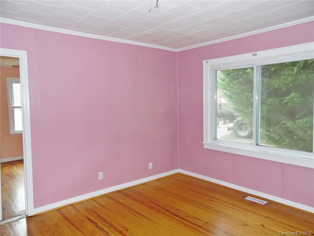 2106 Pinckney Road Chester, SC 29706 - Photo 16 of 18 a view of empty room with window and wooden floor