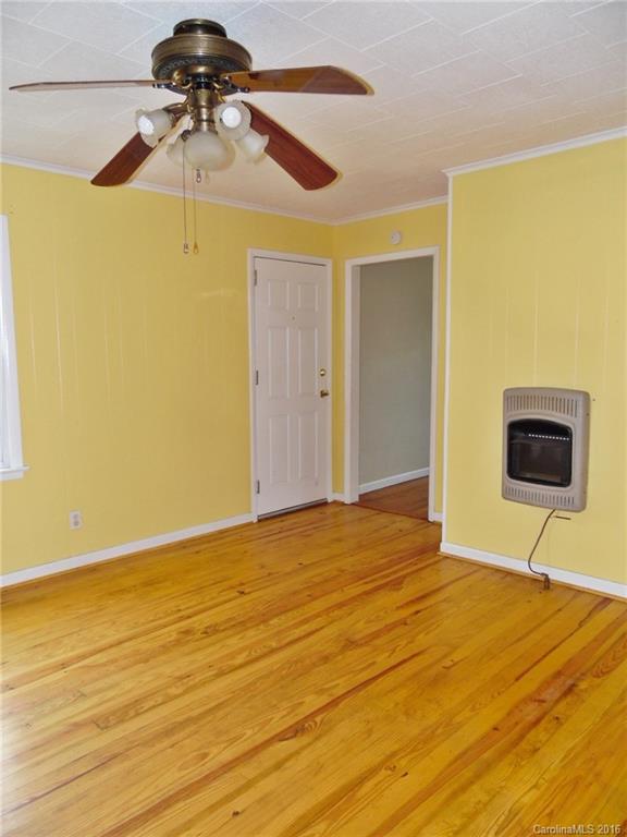 2106 Pinckney Road Chester, SC 29706 - Photo 5 of 18 a bedroom with a bed and a chandelier