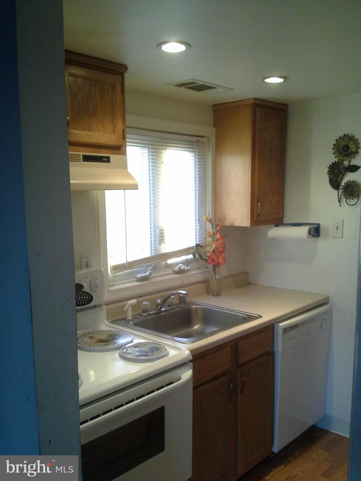 201 Haverhill Road Joppa, MD 21085 - Photo 3 of 6 a kitchen with a sink and a refrigerator