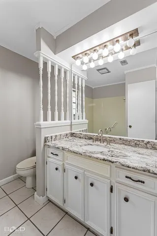 an empty room with window and ceiling fan