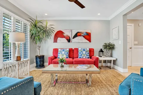 a bedroom with furniture and a potted plant