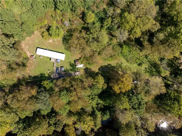 a view of a house with a tree