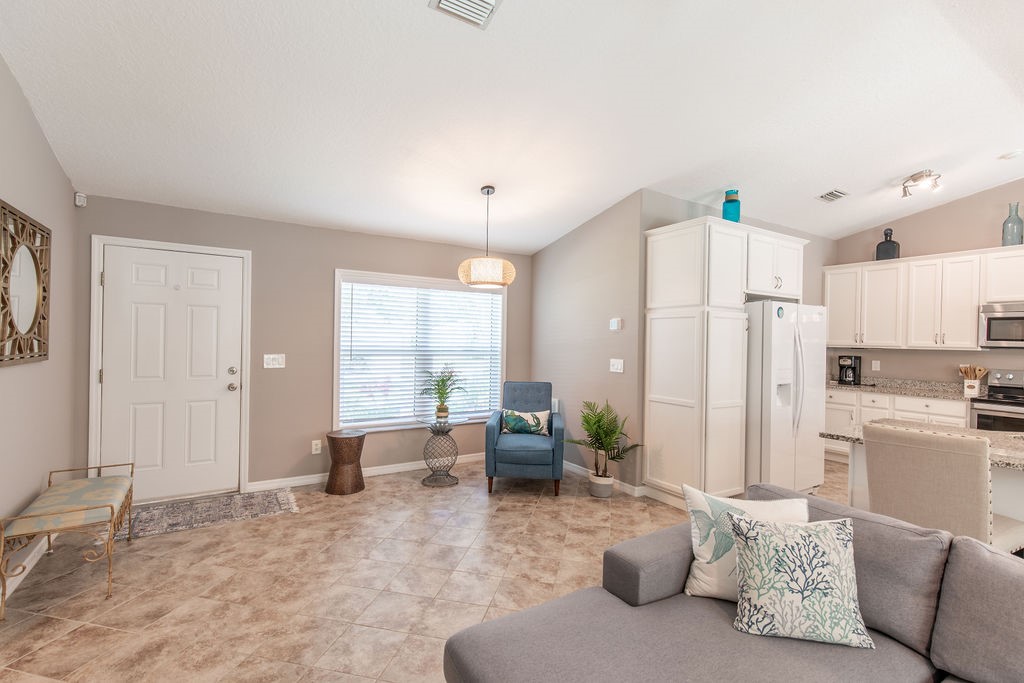 3673 2nd Place Southwest Vero Beach, FL 32968 - Photo 13 of 33 a living room with furniture and a large window
