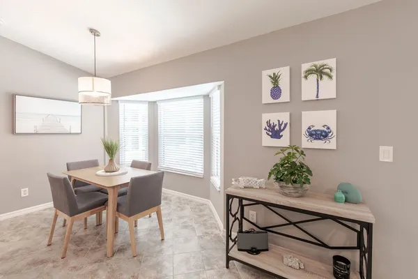 a view of a dining room with furniture window and wooden floor