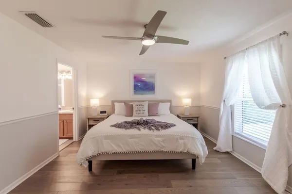 a bedroom with a bed and a window