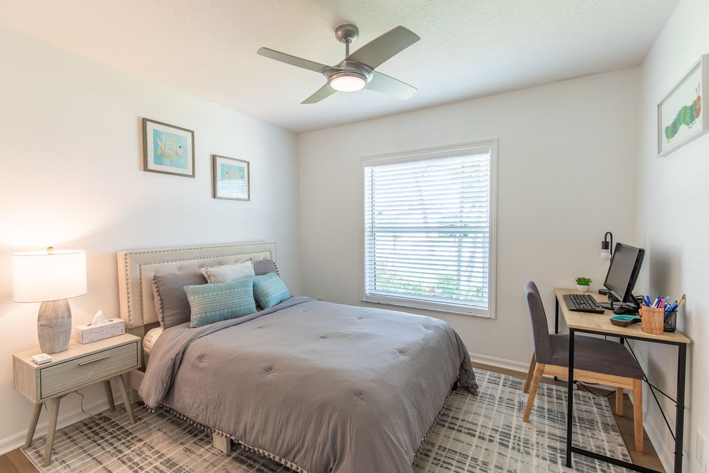 3673 2nd Place Southwest Vero Beach, FL 32968 - Photo 21 of 33 a bedroom with a bed and a window