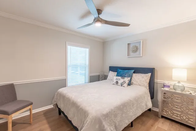 a bedroom with a bed and a night stand