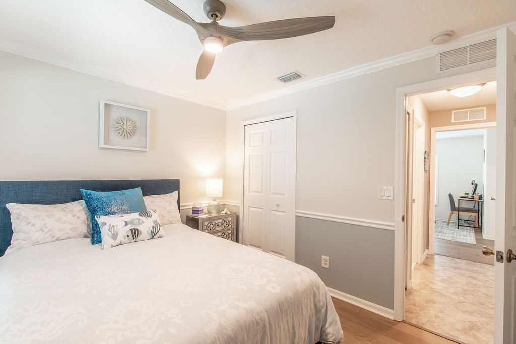 3673 2nd Place Southwest Vero Beach, FL 32968 - Photo 24 of 33 a bedroom with a bed and a view fan