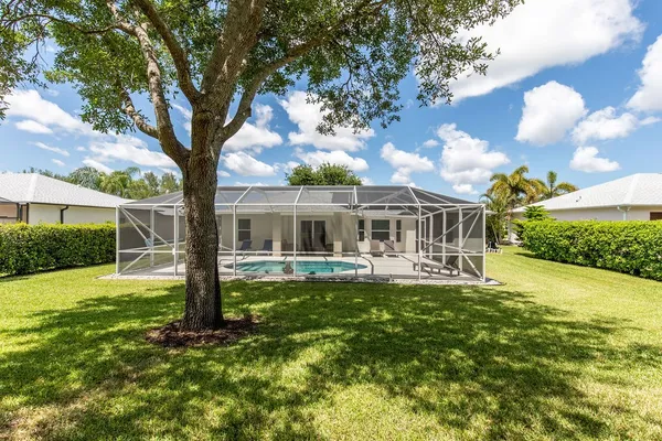 a front view of house with yard and patio