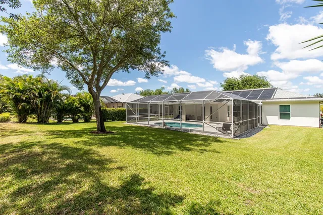 a view of a house with a big yard